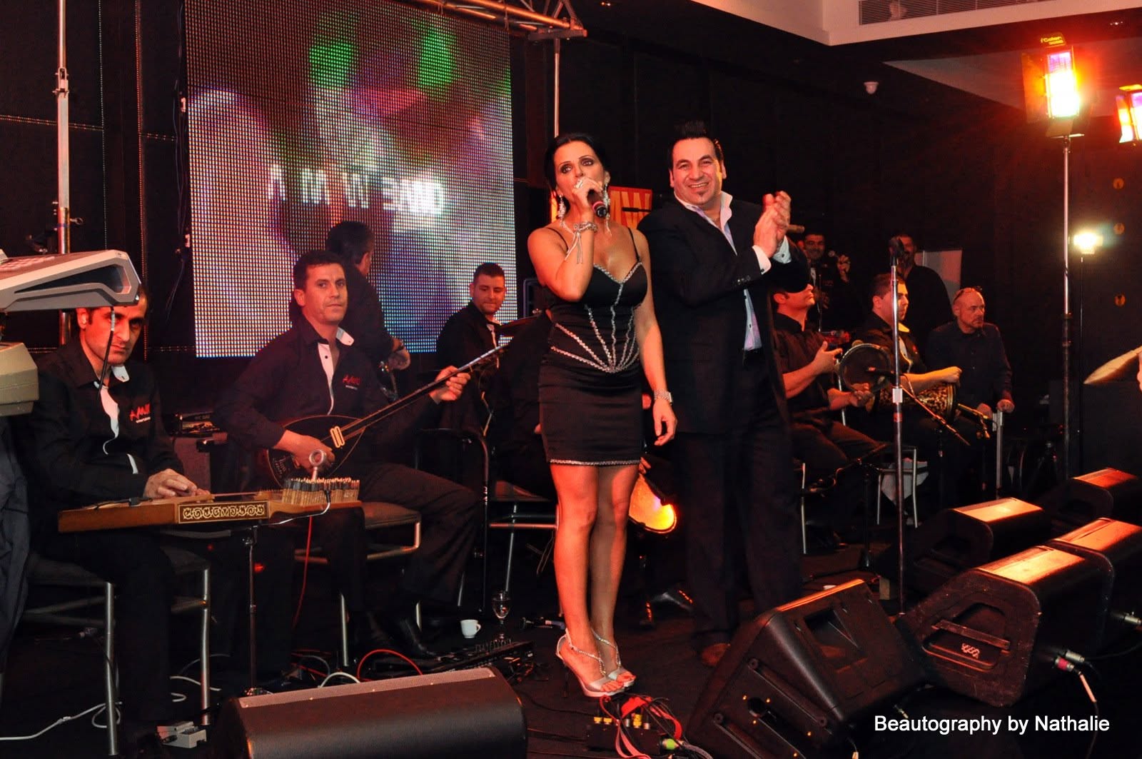 Vocalists and full band on stage